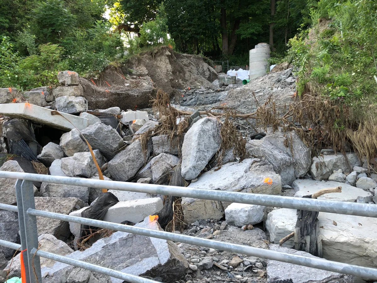 Boulders and debris on hillside.